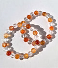 Bergkristal met oranje agaat kogelarmband 8mm