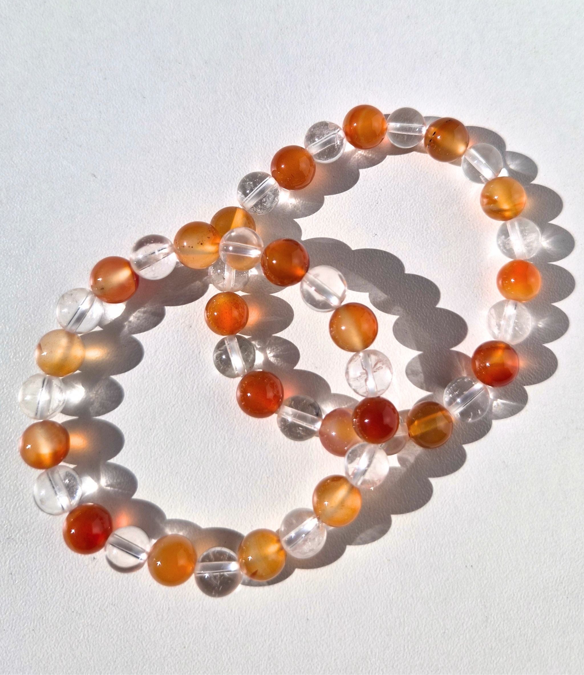 Bergkristal met oranje agaat kogelarmband 8mm